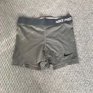 Gray Nike Pro compression shorts.